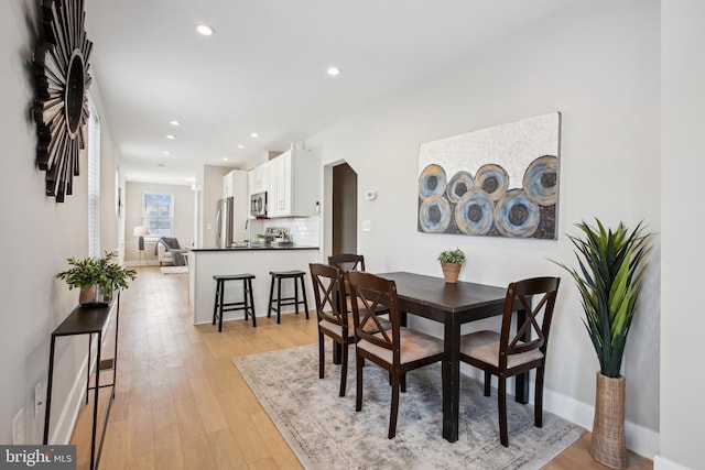 dining room featuring light hardwood / wood-style floors and sink