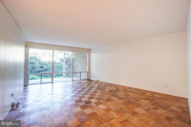 empty room with light parquet flooring