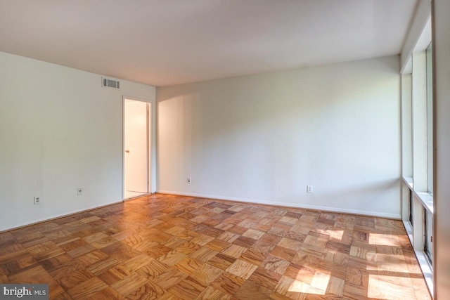 spare room featuring light parquet floors