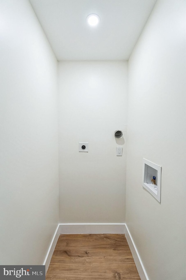 washroom featuring hardwood / wood-style flooring, washer hookup, and hookup for an electric dryer