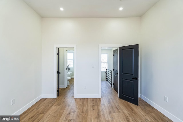 spare room with light hardwood / wood-style flooring