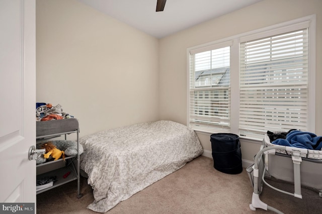 bedroom with light carpet and ceiling fan