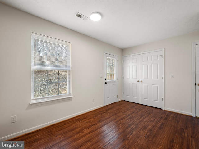 foyer with dark wood-type flooring