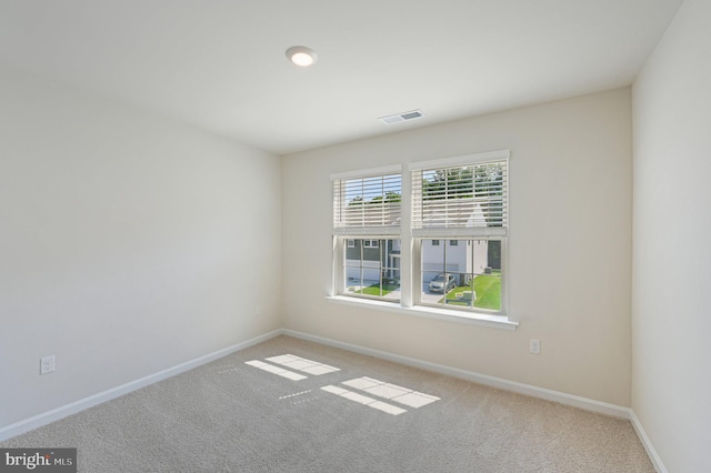 view of carpeted spare room