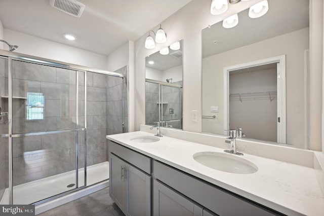 bathroom with vanity and an enclosed shower