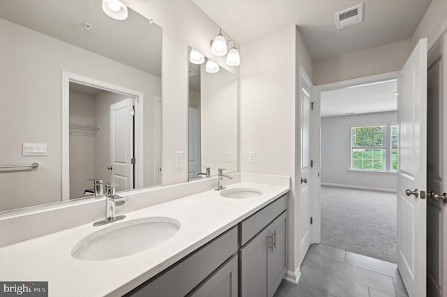 bathroom with vanity and tile patterned floors