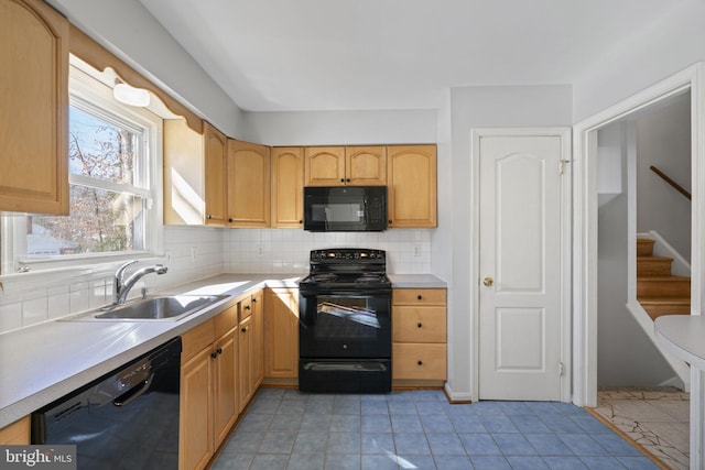 kitchen with sink, light tile patterned floors, black appliances, light brown cabinetry, and decorative backsplash