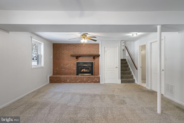 unfurnished living room with a brick fireplace, light carpet, and ceiling fan