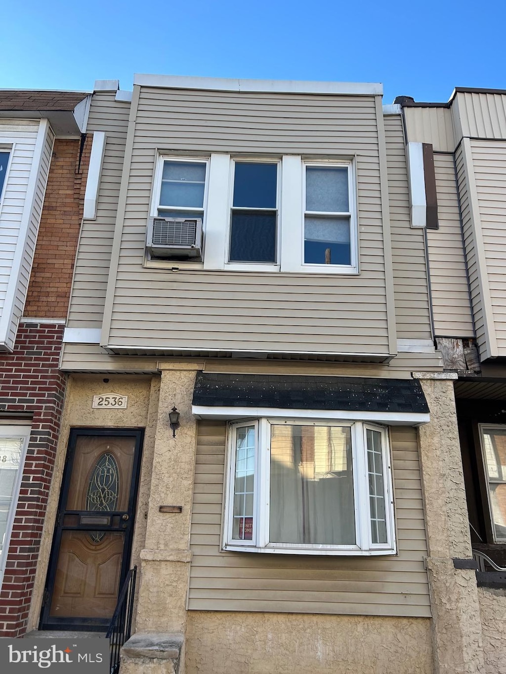 view of front of property featuring cooling unit