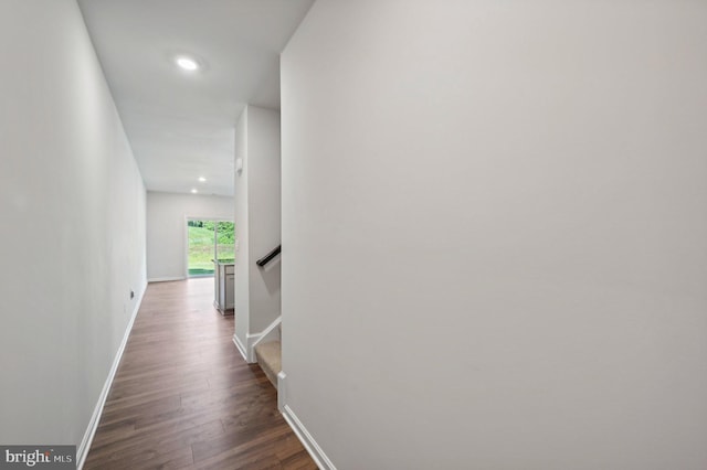 corridor featuring dark wood-type flooring