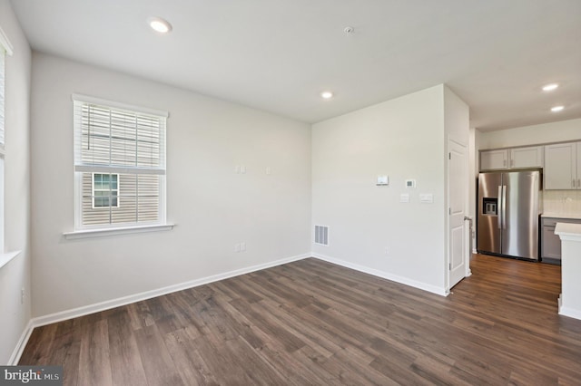 empty room with dark hardwood / wood-style floors