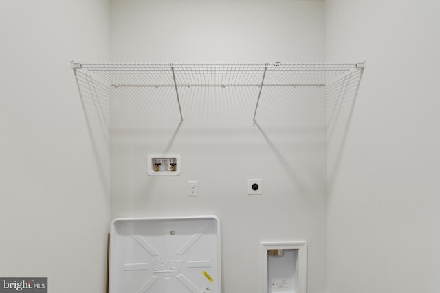 washroom with washer hookup and hookup for an electric dryer