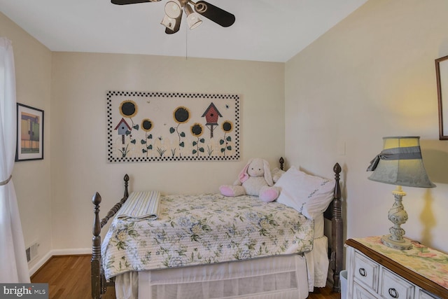 bedroom with ceiling fan and dark hardwood / wood-style floors