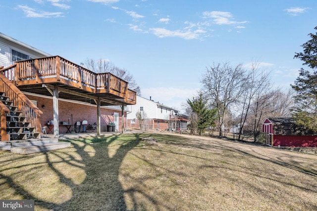 view of yard with a storage unit and a wooden deck