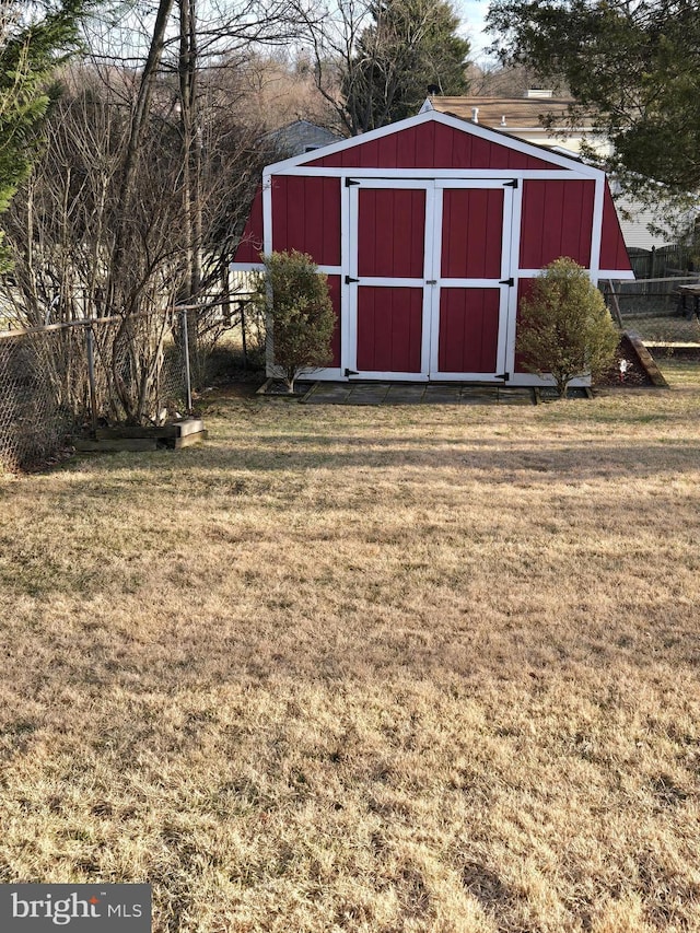 view of outdoor structure featuring a lawn