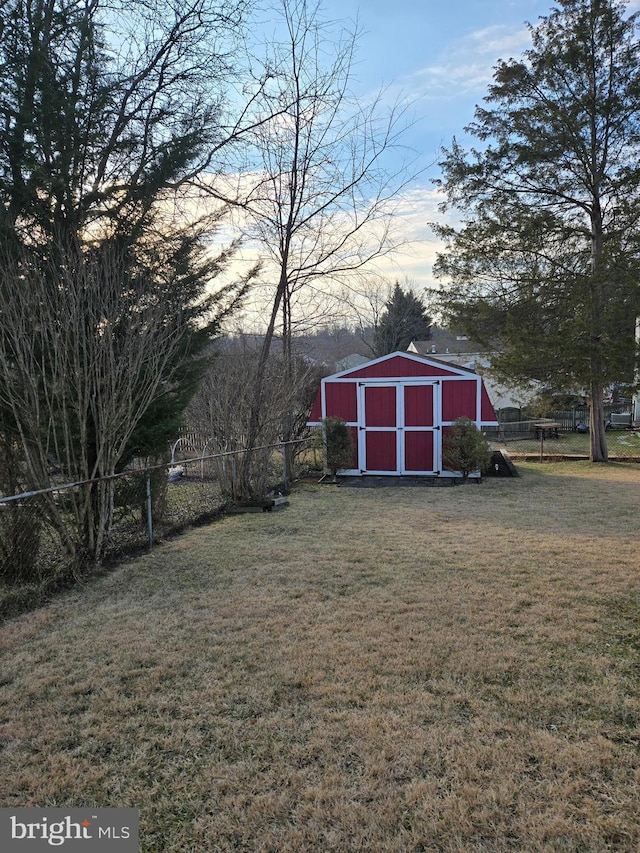 yard at dusk with a storage unit