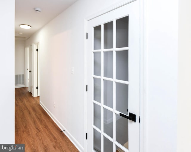 hallway featuring hardwood / wood-style flooring