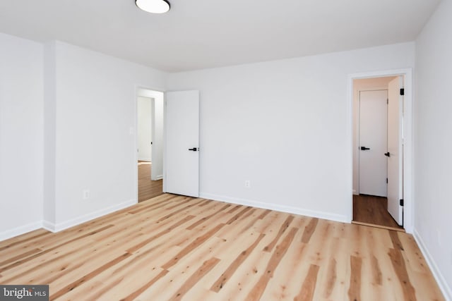 unfurnished bedroom featuring light wood-type flooring