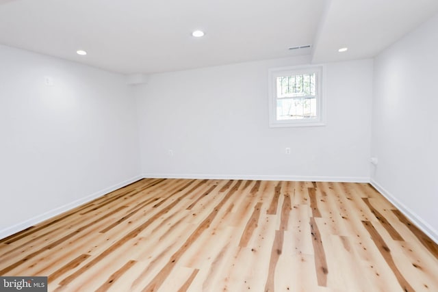 spare room with light hardwood / wood-style floors