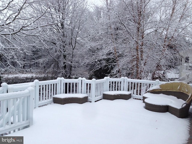 view of snow covered deck