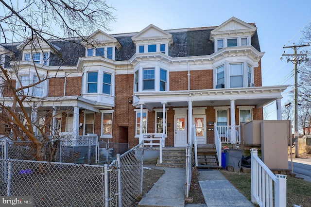 view of property featuring covered porch