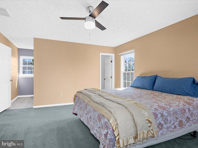 bedroom featuring baseboards, multiple windows, carpet, and visible vents