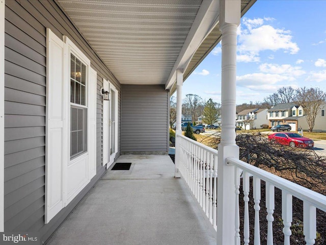 balcony featuring a residential view and covered porch