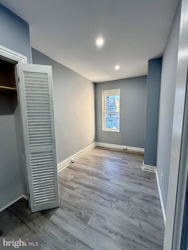 unfurnished bedroom featuring light wood-type flooring