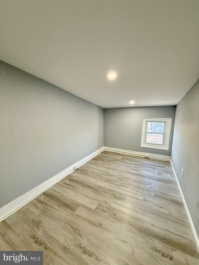 spare room featuring hardwood / wood-style flooring