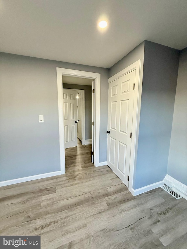 hallway featuring light wood-type flooring