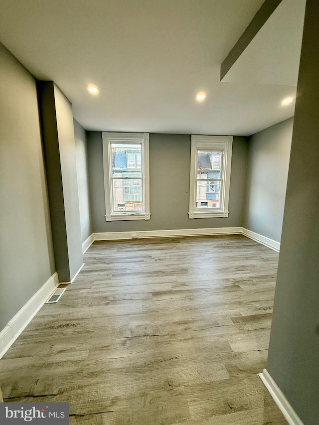 unfurnished room featuring light hardwood / wood-style flooring