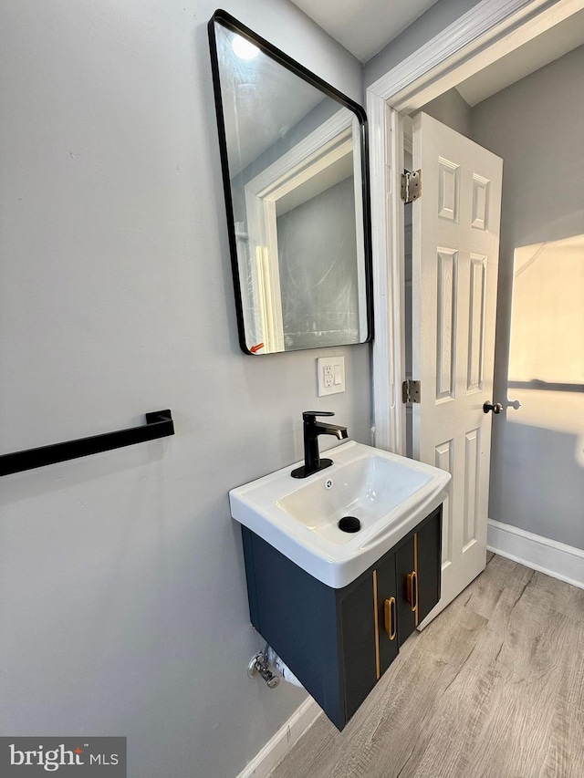 bathroom featuring vanity and hardwood / wood-style floors