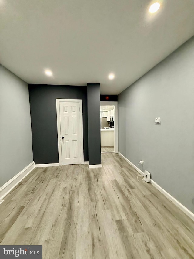 unfurnished room featuring light hardwood / wood-style floors