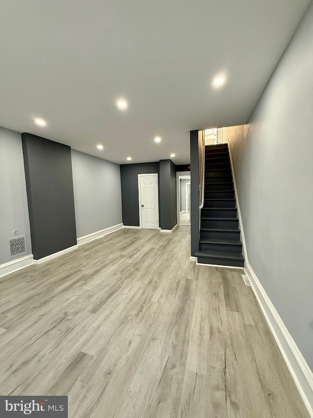 unfurnished living room featuring light wood-type flooring