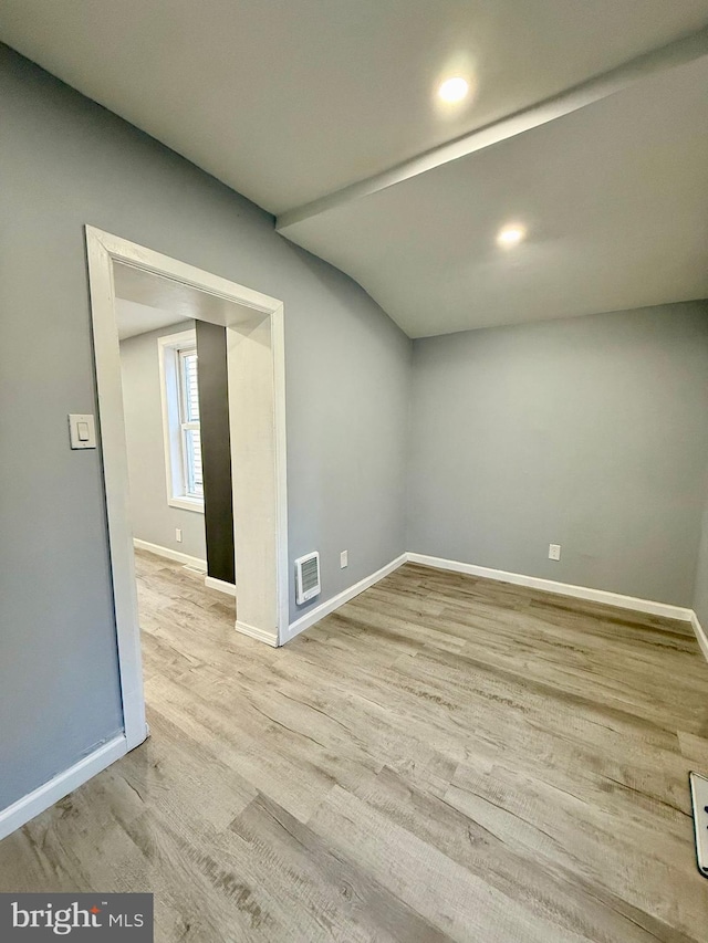 spare room with light hardwood / wood-style flooring