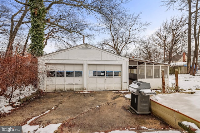 view of snow covered garage