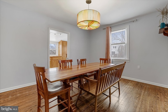 dining area with hardwood / wood-style floors