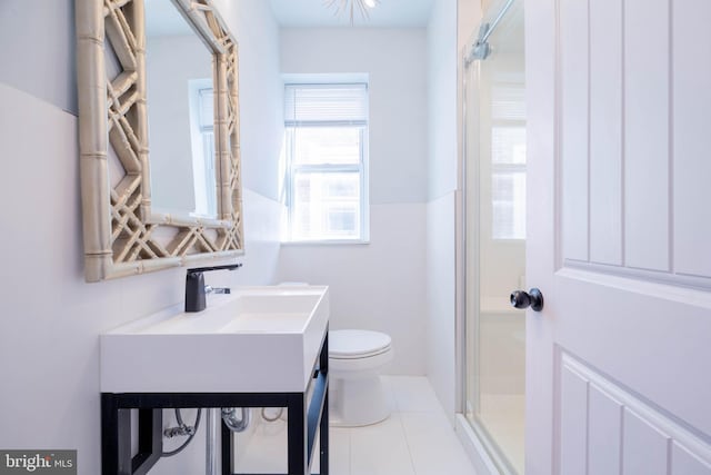 bathroom with toilet, tile patterned flooring, a shower, and vanity