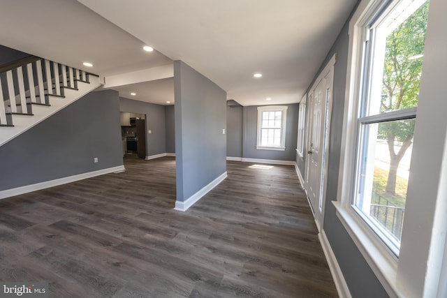 unfurnished room featuring dark hardwood / wood-style floors