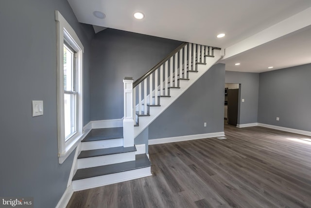 stairway with wood-type flooring