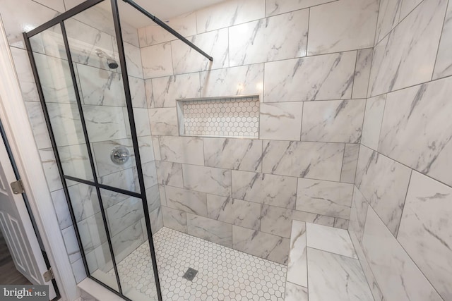 bathroom with tiled shower