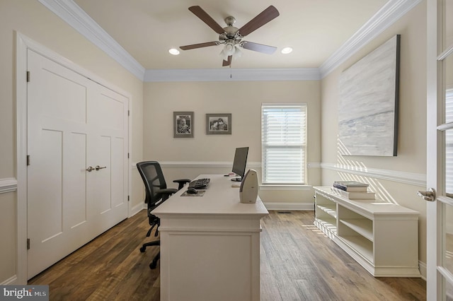 office area featuring ceiling fan, ornamental molding, and wood-type flooring