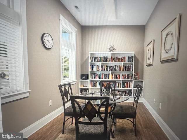 dining room with hardwood / wood-style flooring