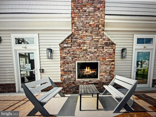 view of patio / terrace featuring a fireplace