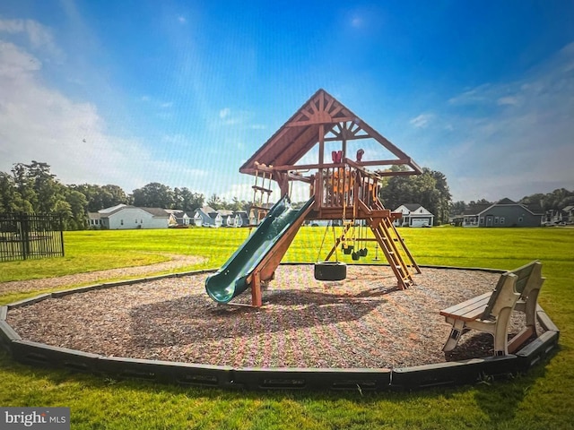 view of playground with a lawn