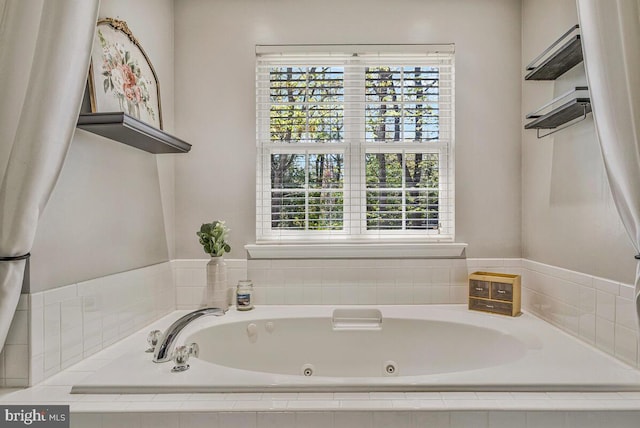 full bath featuring a jetted tub and plenty of natural light