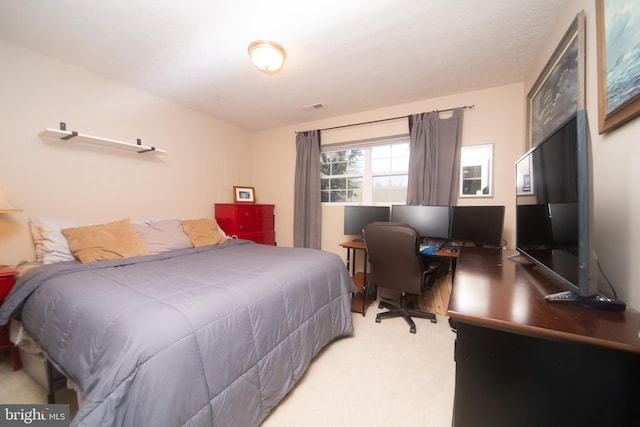 carpeted bedroom with visible vents