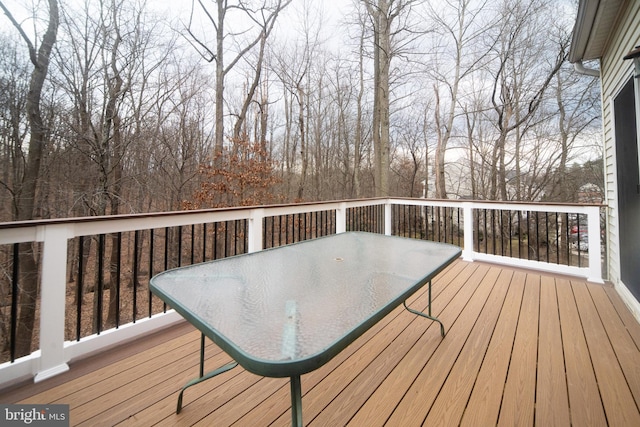 wooden terrace with outdoor dining space