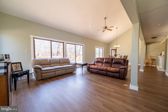 living room with baseboards, high vaulted ceiling, dark wood finished floors, and a notable chandelier