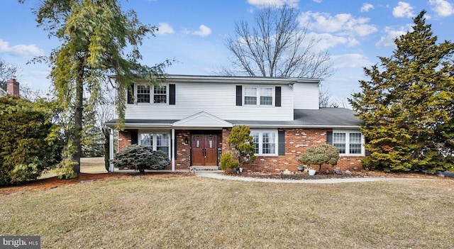 front facade with a front yard